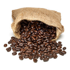 Heap of coffee beans in sack or burlap from top view isolated on white background.