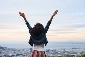 African american woman overlooking the city below