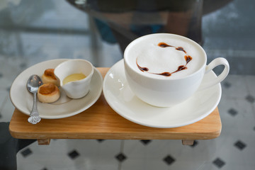 A cup of coffee on glass table 