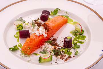  A salmon of Gravlaks with cottage cheese serum, green oil and a crumb Borodino