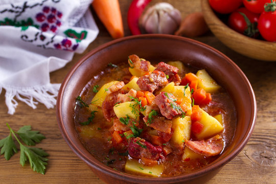 Goulash soup bograch in a bowl. Hungarian dish. Stew, made with beef, bacon, sausages, potatoes and carrots