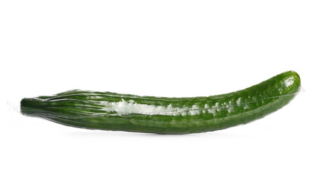 Cucumber in transparent foil isolated on white background