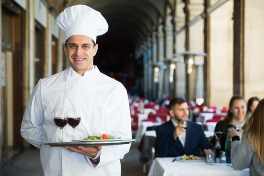 Restaurant chef with serving tray