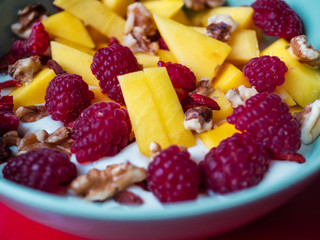 Delicious fruit bowl with red background
