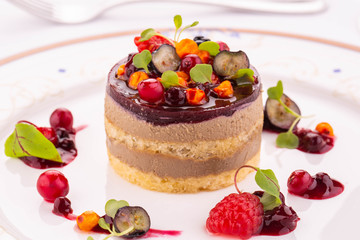 Fresh tortin from a liver of a guinea fowl with raspberry wild berries jelly