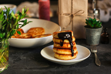 pancakes with chocolate (syrniki). food background