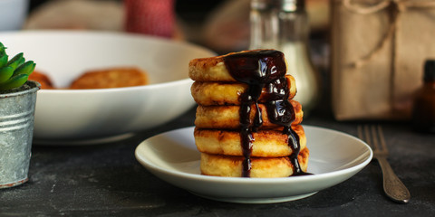 pancakes with chocolate (syrniki). food background