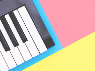 Fototapeta na wymiar Music keyboard synthesizer instrument on blue copy space for Music poster concept