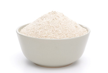 Whole flour in bowl isolated on white background