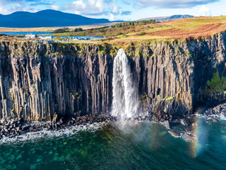 Aerial view of the dramatic coastline at the cliffs by Staffin with the famous Kilt Rock waterfall...