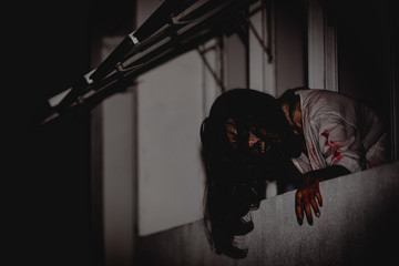 Portrait of asian woman make up ghost face with blood,Horror scene,Scary background,Halloween...