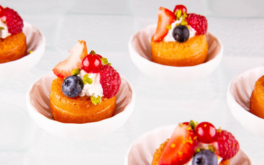A vanilla biscuit with a pistachio crumb and fresh berries