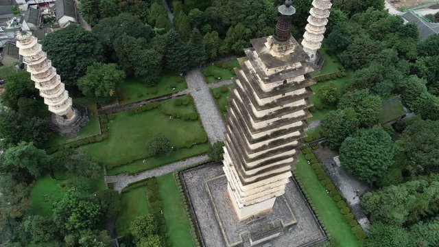 Tilting drone footage of iconic Three Pagodas in Dali, China