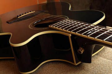 Musical instrument - Fragment brown cutaway acoustic guitar