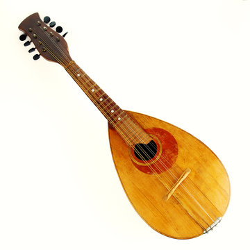 Old mandolin located diagonally on a black background. Isolated on white background.