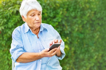 old woman talking on the phone, smartphone, smiling, call children