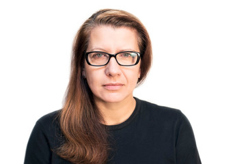Fototapeta premium Woman on a white background with red, tired eyes. A woman recently began to wear glasses because her eyesight began to deteriorate