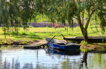 Wooden pier on the lake and boat