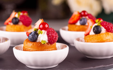 Small desserts with currant and pistachios