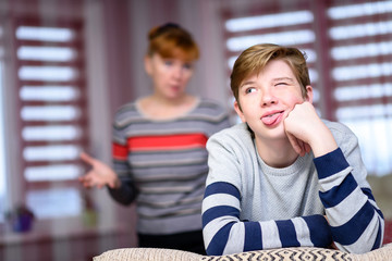 mother and child sit in the room near the window