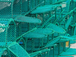 New Lobster Pots Stacked On The Harbour At The Costal Town Of Amble, Northumberland