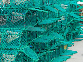 New Lobster Pots Stacked On The Harbour At The Costal Town Of Amble, Northumberland
