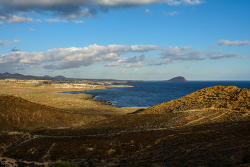 Fototapeta na wymiar The Yellow Mountain on the ocean shore in Costa del Silencio, Tenerife.