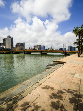A view of Capibaribe river with Mauricio de Nassau bridge and cityscape in the background - Recife, Brazil
