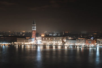 Fototapeta na wymiar Long exposure on the bell tower seeing the San Marcos square in Venice on a December night 