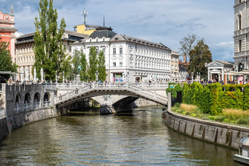 Fototapeta na wymiar The Triple Bridge is a group of three bridges across the Ljubljanica River. Slovenian capital, Ljubljana