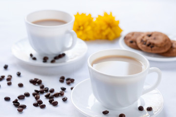 Breakfast for two with coffee and oatmeal cookies.