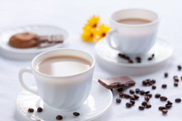 Breakfast for two with coffee, oatmeal cookies and milk chocolate.