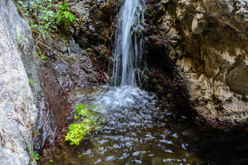 Naklejka na ściany i meble Waterfall in the end of Barranco del Infierno hiking trail.