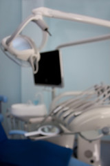 Dental treatment unit and other service equipment with blur effect. Themed blur background with bokeh effect.