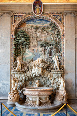 Caprarola: Palazzo Farnese rustic fountain in Loggia of Hercules, made mosaic and polychrome stucco...