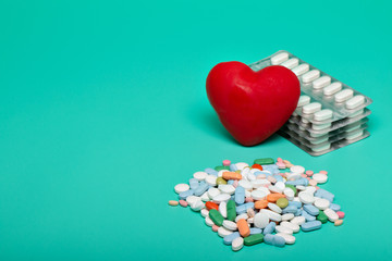 Red heart with different pills