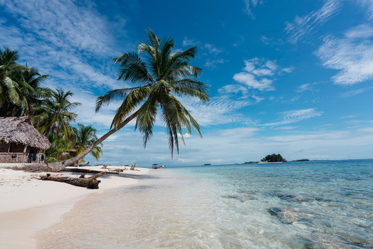 Scenic view of beach against cloudy sky