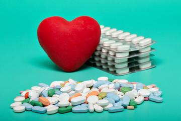 Red heart with different pills