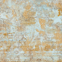 Abstract metallic textured background. Collage with gold glitter, sparkles and foil mixed with an artsy colorful texture.