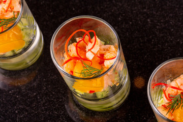 Snack fish with fresh vegetables and greens