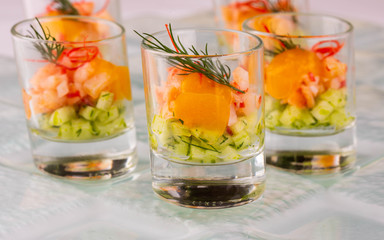 Shota with fish snack, vegetables and greens