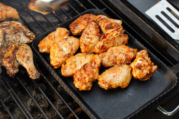 Chicken wings on barbecue grill. Tasty, beautiful and appetizing. Clouse-up.