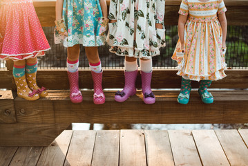 Four girls in dresses and boots