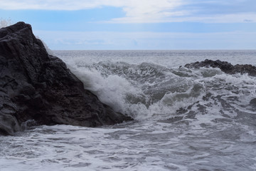 Waves breaking on the rock