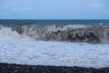 Stormy sea waves breaking near the coast