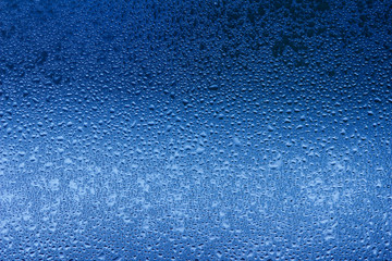 Macro abstract background design of window condensation in blue hues - obrazy, fototapety, plakaty