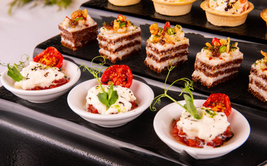 Mozzarella, dried tomatoes, greens, fat, bread, caramelized onions, hot pepper