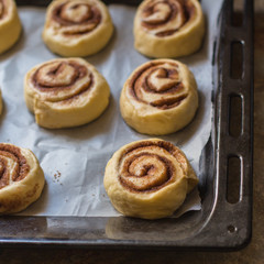 cinnamon buns - Cinnabon cooking process raw dough. (food background). copy space