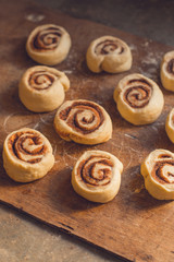 cinnamon buns - Cinnabon cooking process raw dough. (food background). copy space