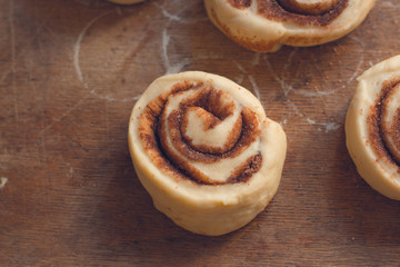 cinnamon buns - Cinnabon cooking process raw dough. (food background). copy space